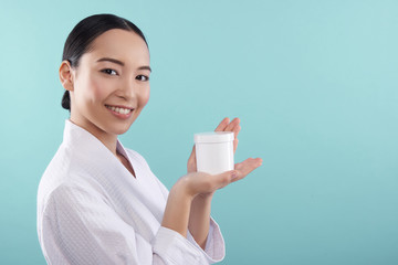 Wall Mural - Portrait of young pretty Asian woman with pure skin looking at camera