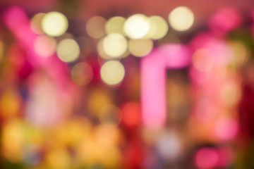 Wall Mural - Abstract blurred and bokeh of gifts shop lighting bulbs on blurry in front of the shop background.