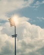 © Andre Silva - Stadium floodlights against cloudy sky