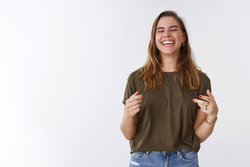 Wall Mural - Happiness, delight, wellbeing concept. Attractive carefree charming positive woman having fun laughing out loud sincere close eyes saying haha gesturing hearing hilarious joke, chuckling