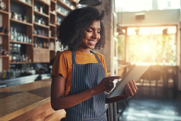 Poster - Woman barista take order with tablet