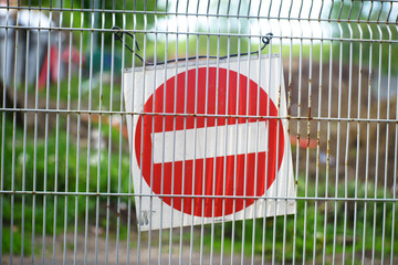 Red and White British No Entry Road Sign with Steel Fence, Red Stop Road Sign, Traffic Sign Prohibiting, Fence Grilles Rust Texture Background, Warning Sign at Fence Wall, Prohibition Sign