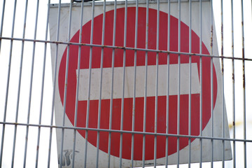 Wall Mural - Red and White British No Entry Road Sign with Steel Fence, Red Stop Road Sign, Traffic Sign Prohibiting, Fence Grilles Rust Texture Background, Warning Sign at Fence Wall, Prohibition Sign