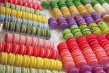 Fototapeta Tęcza - Rows of colorful macaron cookies in a pastry shop