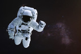 Fototapeta Kosmos - Astronaut in outer space. Science fiction wallpaper. Elements of this image were furnished by NASA.