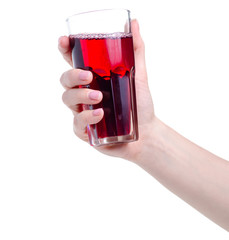 Canvas Print - Cherry juice in a glass in hand on white background isolation