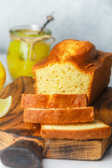 Wall Mural - Homemade pound cake with lemon and jam. Traditional treat for tea. Citrus loaf cake. Selective focus
