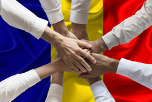Union Or Team Hands Multcultural People Team Over Romanian Flag Topview	