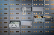Open safe deposit box with money, jewels and golden ingots. Financial banking investment concept.