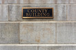 Generic county building sign on concrete block building