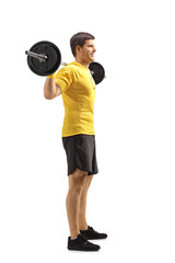 Canvas Print - Young man standing and lifting weights on shoulders