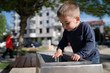 © Miljan Živković - Little boy at the public fountain playing with water drinking in summer sunny day thirsty refreshment