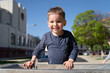 © Miljan Živković - Little boy at the public fountain playing with water drinking in summer sunny day