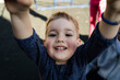 © Miljan Živković - High angle view on little boy holding a bar in the park