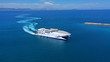 Aerial drone top view photo of high speed passenger ferry arriving at port of Mykonos island, Cyclades, Aegean sea, Greece