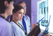 © lenets_tan - Hospital doctors looking at x-rays in an emergency room