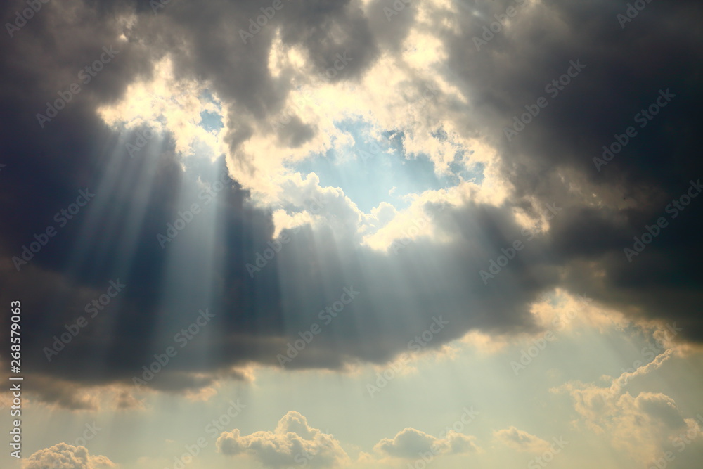 Obraz Ray of sun light shine through the gap among cloud for hope and optimism concept fototapeta, plakat