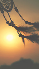 Blurred Image, Dream Catcher Native American In The Wind And Blurred Bright Light Background, Hope And   Dream Concepts