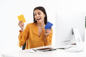 Sticker - Portrait of cute young designer woman using graphic tablet computer and holding data storage devices in bright office