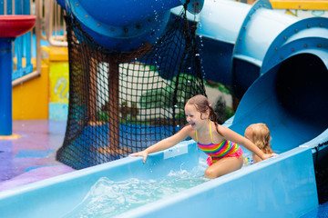 Wall Mural - Kids at aqua park. Child in swimming pool.