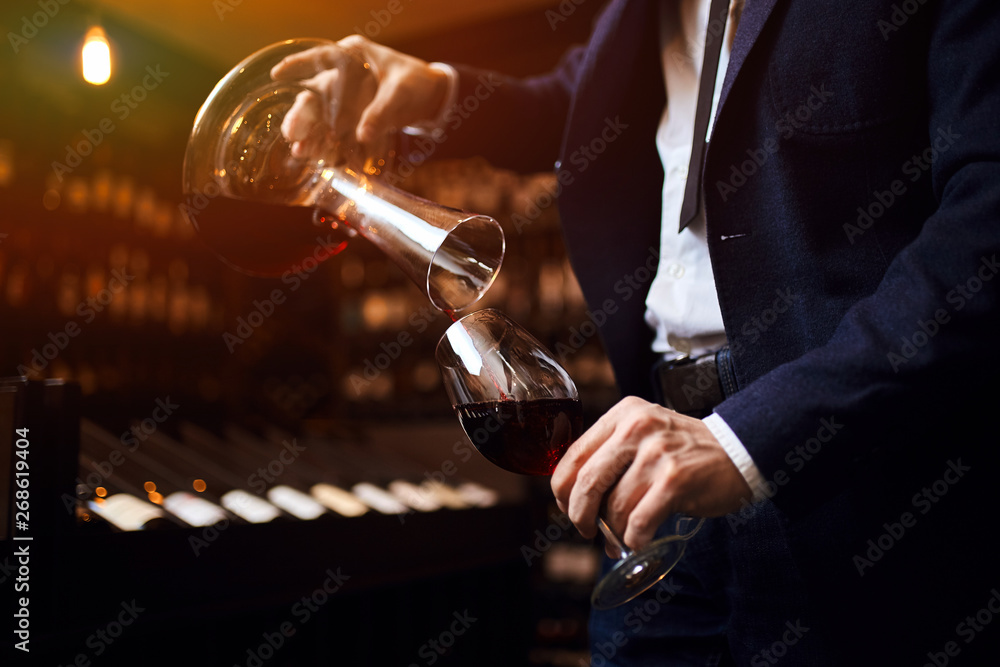 provide excellent wine service,presentation of the wine and pouring. close up cropped photo - obrazy, fototapety, plakaty 