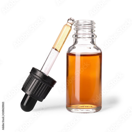 Fotografía Cosmetic bottle and pipette with essential oil on white background