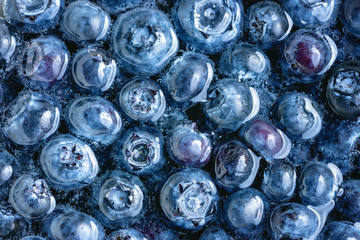 Wall Mural - Blueberries floating in water with bubbles