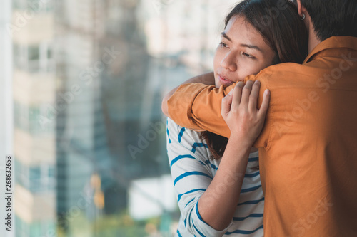 Fotomural Young depressed asian woman hug her friend for encouragement, Selective focus, PTSD Mental health concept