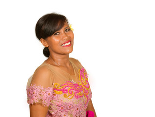 beautiful middle aged 40s Indonesian Balinese woman in traditional religious ceremony dress smiling cheerful on isolated background in welcome to Bali Hindu religion