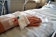 Female patient with infusion drip in hospital. arm of Woman, patient's hand, bottle of infusion in a hospital room during the Coronavirus COVID-19 disease epidemic, corona virus pandemic outbreak.