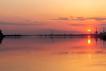 Wall Mural - Beautiful orange sunset on the river.