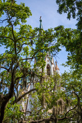 Canvas Print - The Old Saint Johns Church in Savannah, Georgia through the trees