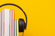 © netrun78 - Group of books with the earphones. Audiobooks concept