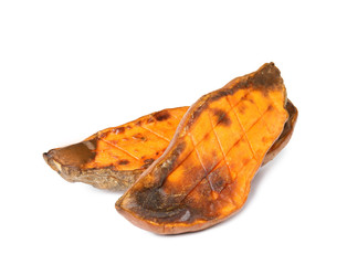 Pieces of baked sweet potato on white background