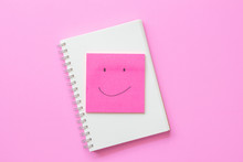 Smile Face On Post It Note On Pink Background