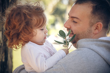 baby with happy father in the park