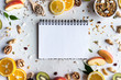 © insta_photos - Healthy food nutrition concept, fresh summer fruits nuts granola seeds and empty blank notebook on white background, organic super food on table, detox diet for health care, top view, copy space