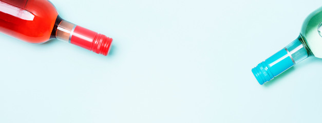 Wall Mural - Colorful bottle caps of white and rose wine bottles on turquoise background. Minimal abstract colorful layout concept of summer time alcohol beverage. Long wide banner.