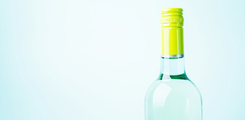 Wall Mural - Screw bottle foil caps in different bright colors of white and rose wine bottles on blue background with copy space. Minimal abstract colorful mockup concept of alcohol beverage. Flat lay.