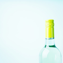 Wall Mural - Screw bottle foil caps in different bright colors of white and rose wine bottles on blue background with copy space. Minimal abstract colorful mockup concept of alcohol beverage. Flat lay.