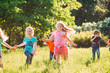 © davit85 - Large group of kids, friends boys and girls running in the park on sunny summer day in casual clothes .