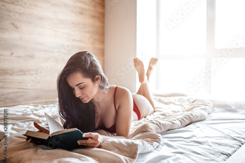 Seductive Young Naked Dark Haired Woman On Bed In Morning