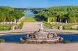 © rustamank - View of the Versailles Park - the Latona Basin with the Grand Canal in the background under the summer sun, Versailles, France