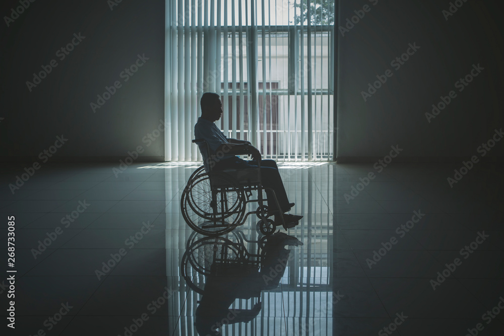 Lonely elderly man looks sad in the wheelchair - obrazy, fototapety, plakaty 
