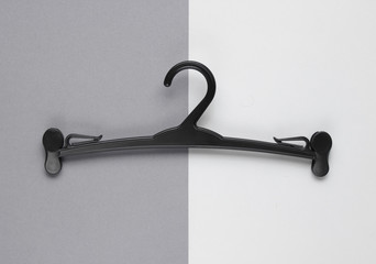 Wall Mural - Plastic hanger on gray background. Top view