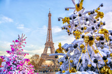 Eiffel Tower Is The Main Attraction Of Paris On The Background Of Decorated Christmas Trees In December. Travel Greeting Card With Christmas In Paris, France