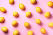 Food pattern with lemons on pink paper background. Top view. Summer concept. Vegan and vegetarian diet