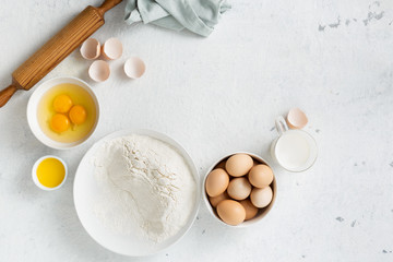 Poster - Dough ingredients on a white background top view
