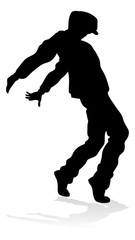 Wall Mural - A male street dance hip hop dancer in silhouette