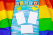 © NewFabrika - Gay pride flag on wooden table